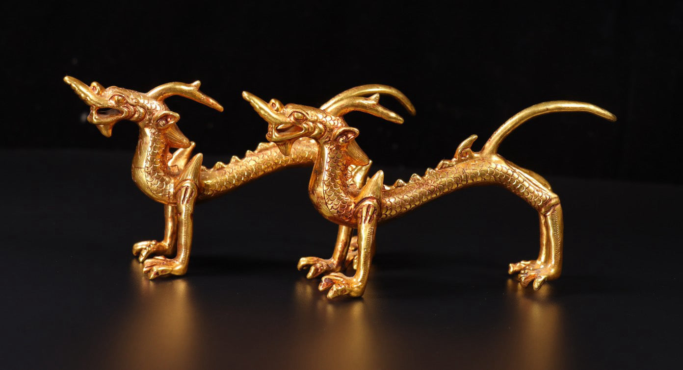 A pair of Chinese antique handmade copper gilded gold high relief carved dragons