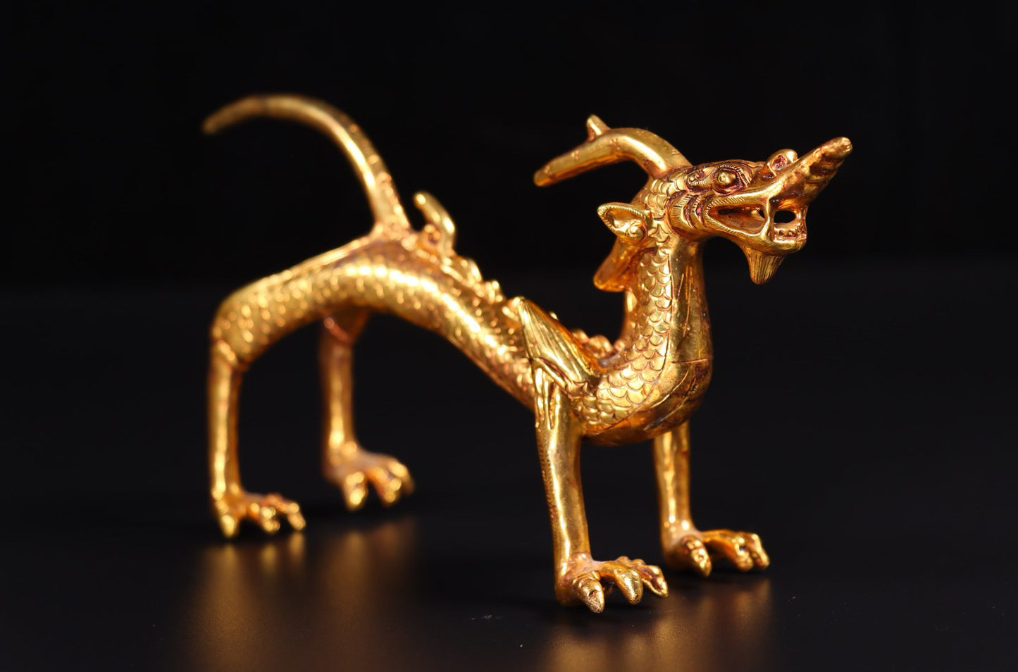 A pair of Chinese antique handmade copper gilded gold high relief carved dragons