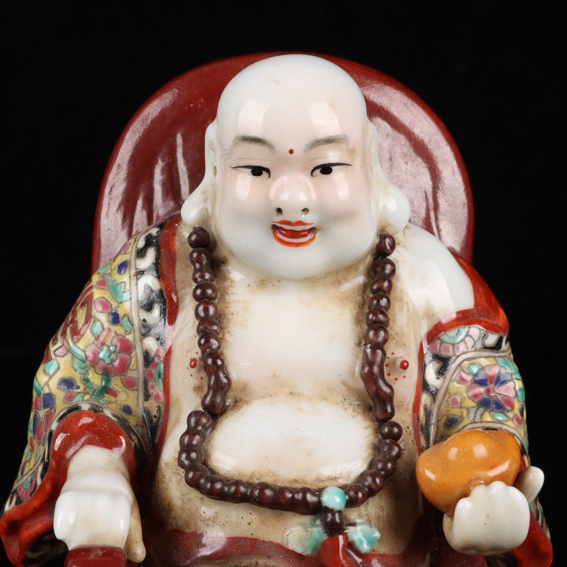 Pink rocking chair with big belly Buddha