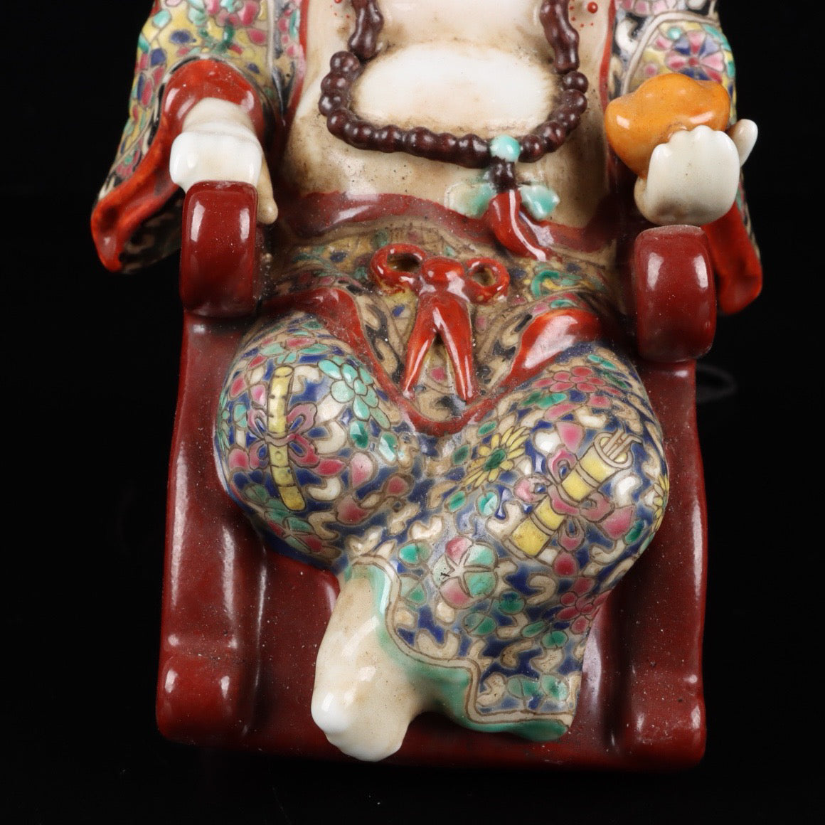 Pink rocking chair with big belly Buddha
