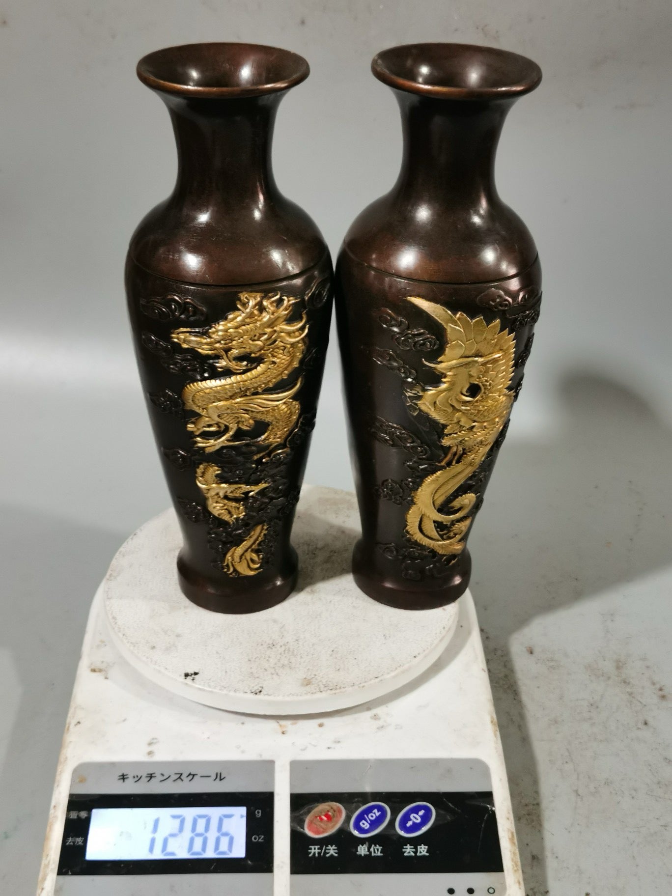 A pair of Chinese antique pure copper dragon and phoenix auspicious vases