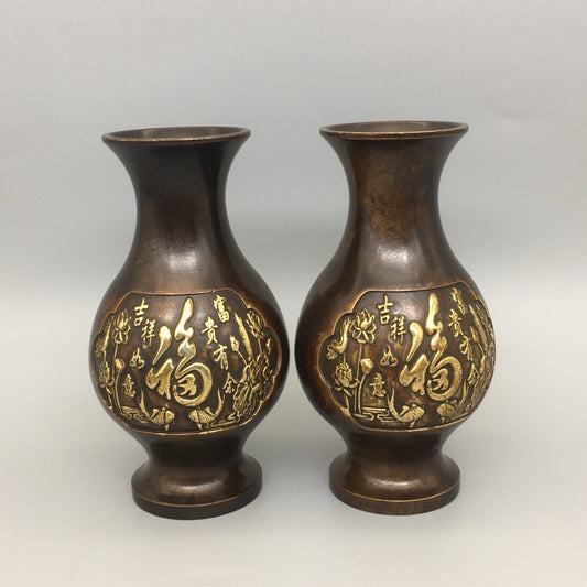 A pair of Chinese antique pure copper lucky character vases