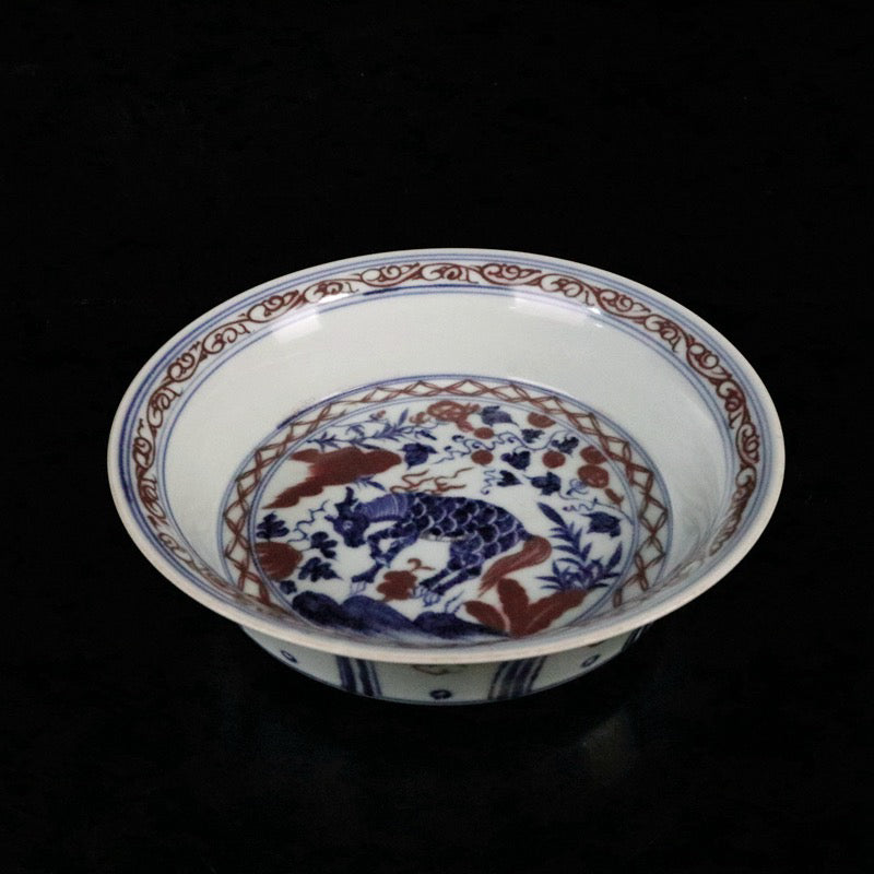 Blue and white glazed red auspicious beast pattern plate