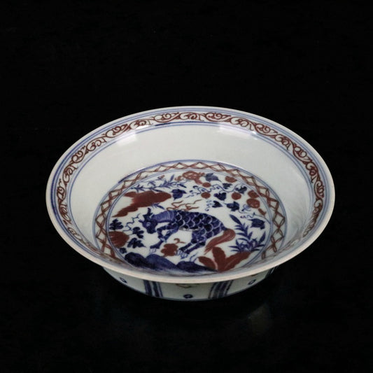 Blue and white glazed red auspicious beast pattern plate