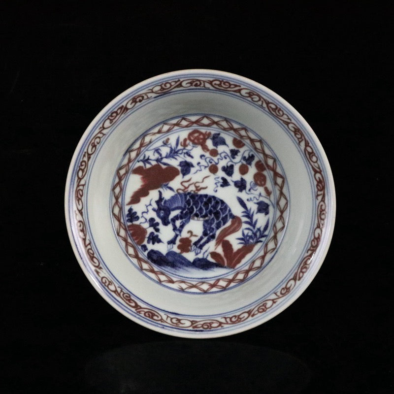 Blue and white glazed red auspicious beast pattern plate