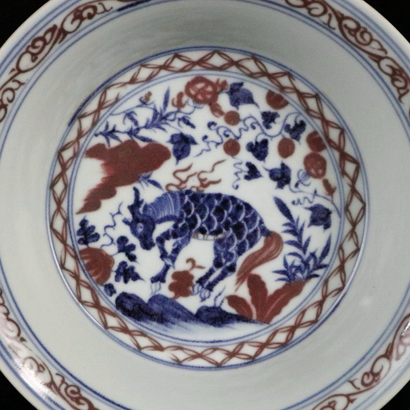 Blue and white glazed red auspicious beast pattern plate