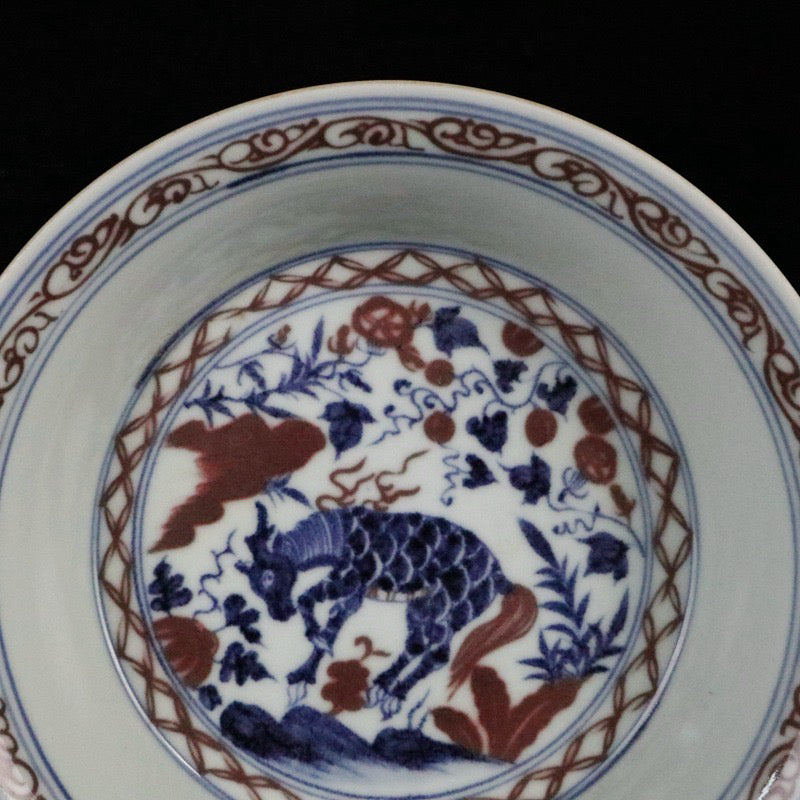 Blue and white glazed red auspicious beast pattern plate