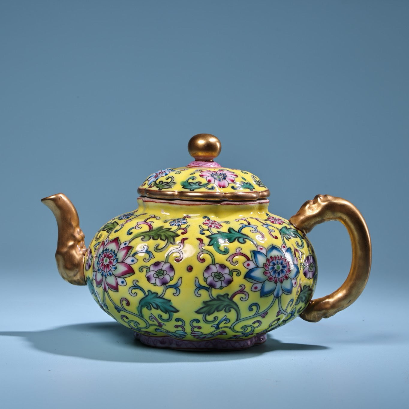 Enamel gilded gold colored porcelain teapot