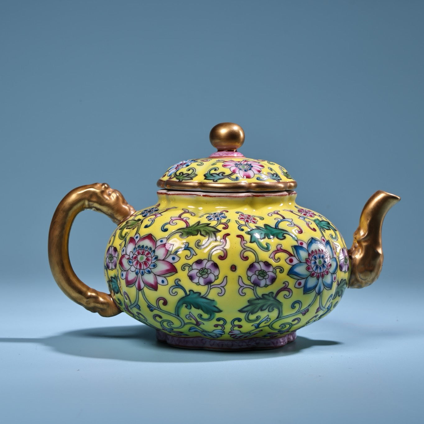 Enamel gilded gold colored porcelain teapot