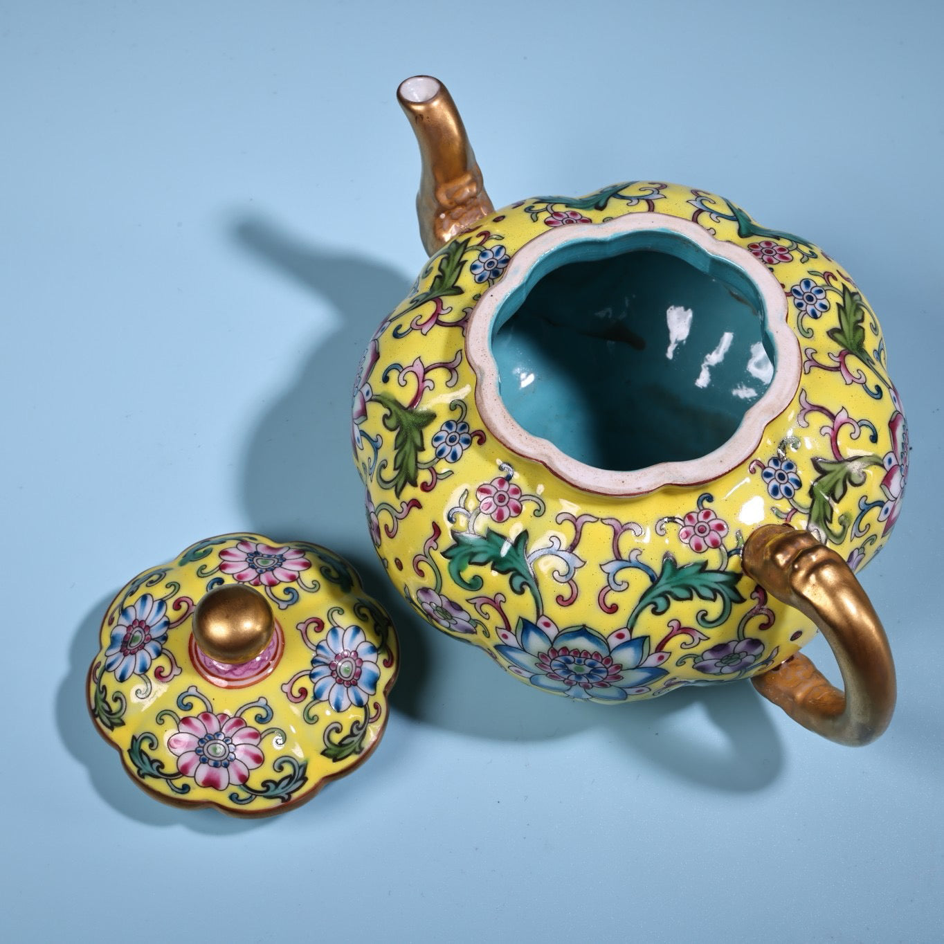 Enamel gilded gold colored porcelain teapot