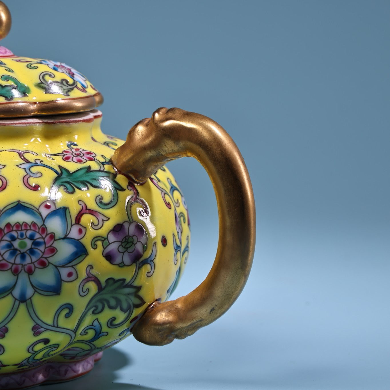 Enamel gilded gold colored porcelain teapot