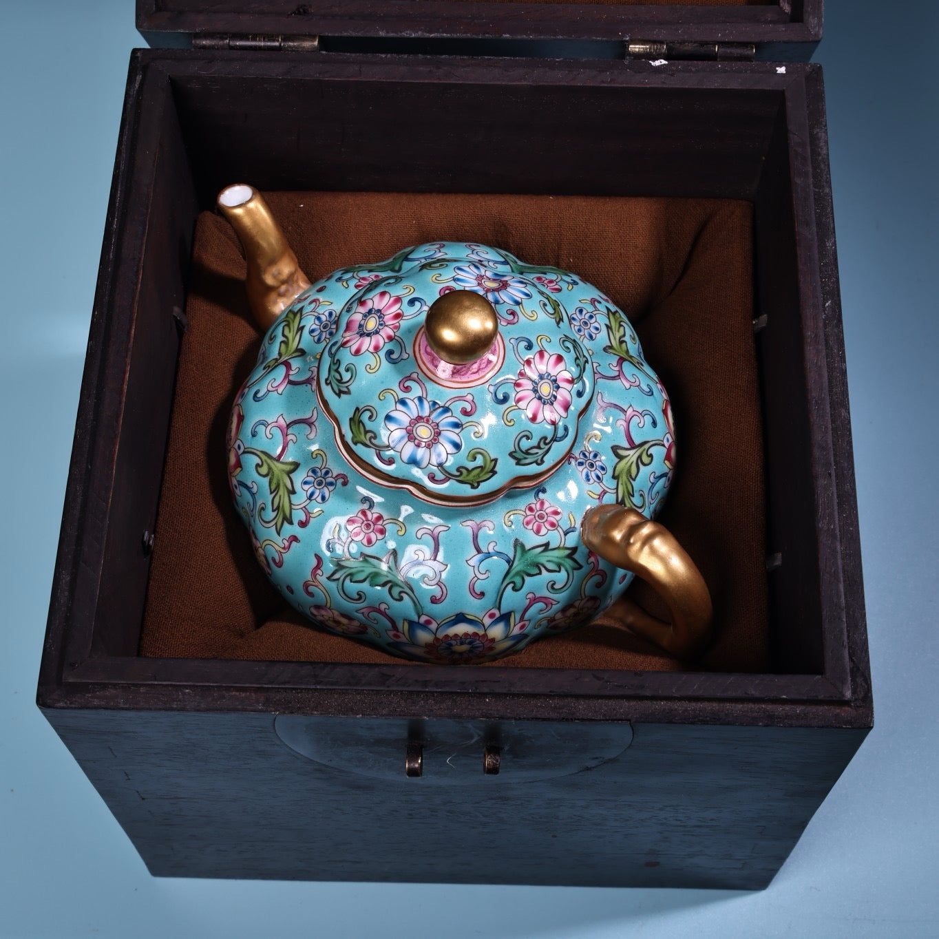 Enamel gilded gold colored porcelain teapot