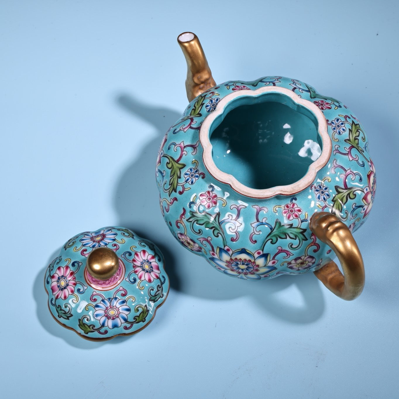 Enamel gilded gold colored porcelain teapot