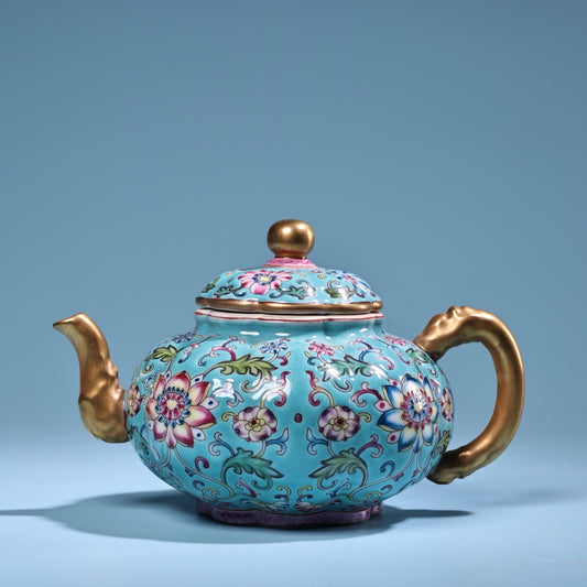 Enamel gilded gold colored porcelain teapot