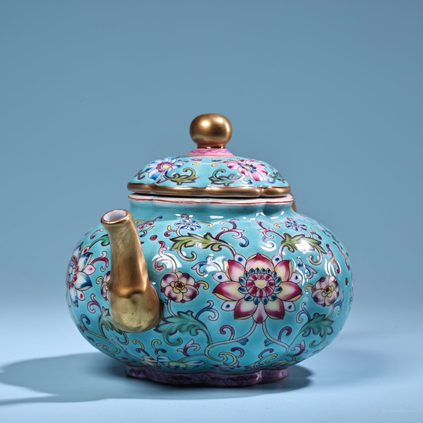 Enamel gilded gold colored porcelain teapot
