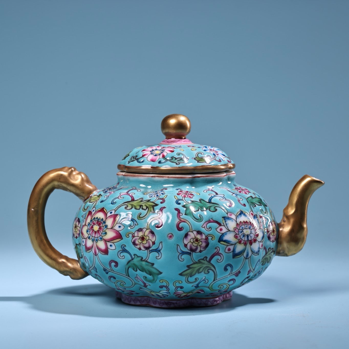 Enamel gilded gold colored porcelain teapot