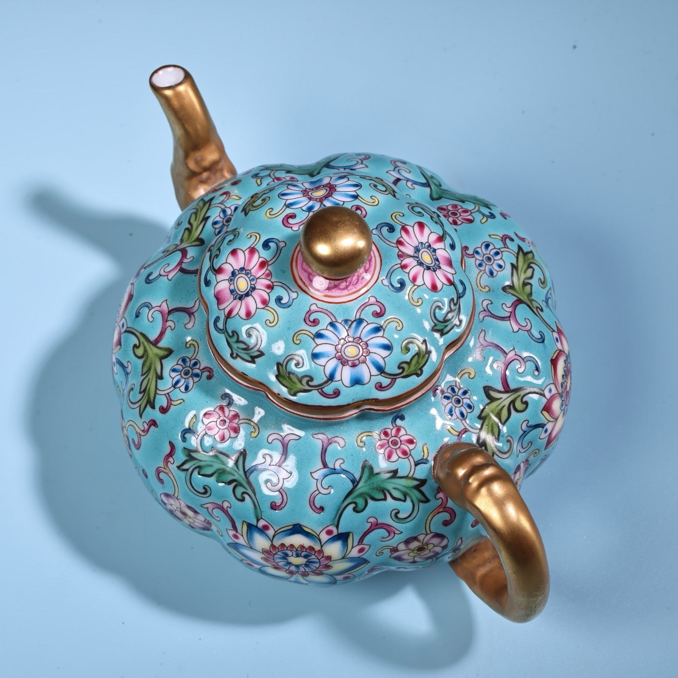 Enamel gilded gold colored porcelain teapot