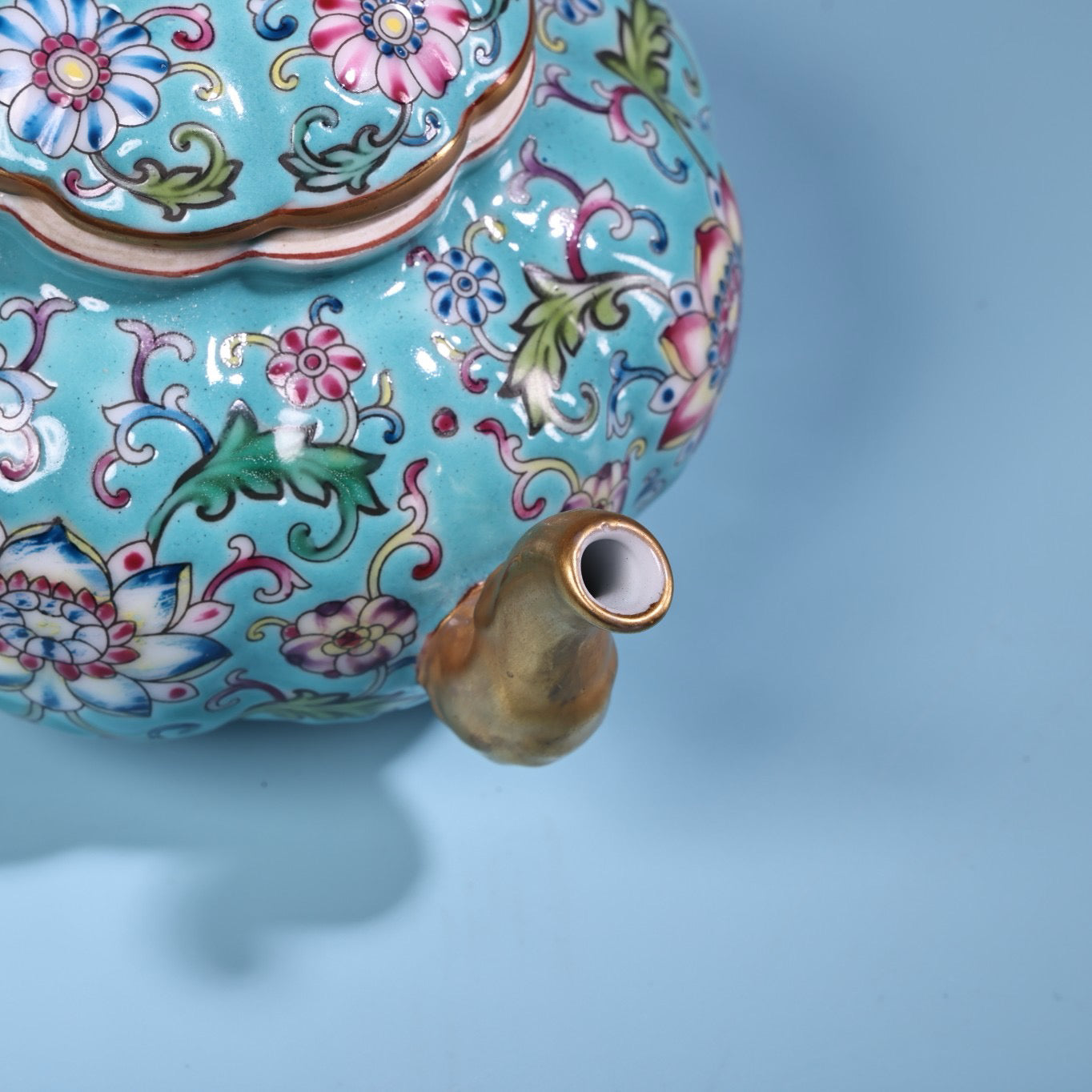 Enamel gilded gold colored porcelain teapot
