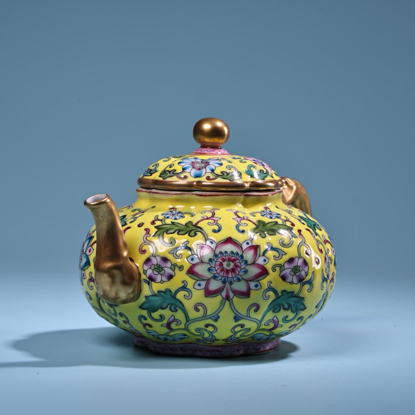 Enamel gilded gold colored porcelain teapot