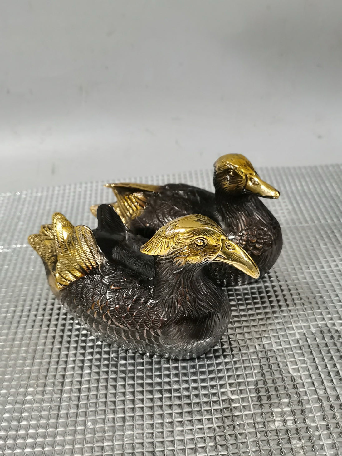 A pair of Chinese antique pure copper gilded mandarin ducks