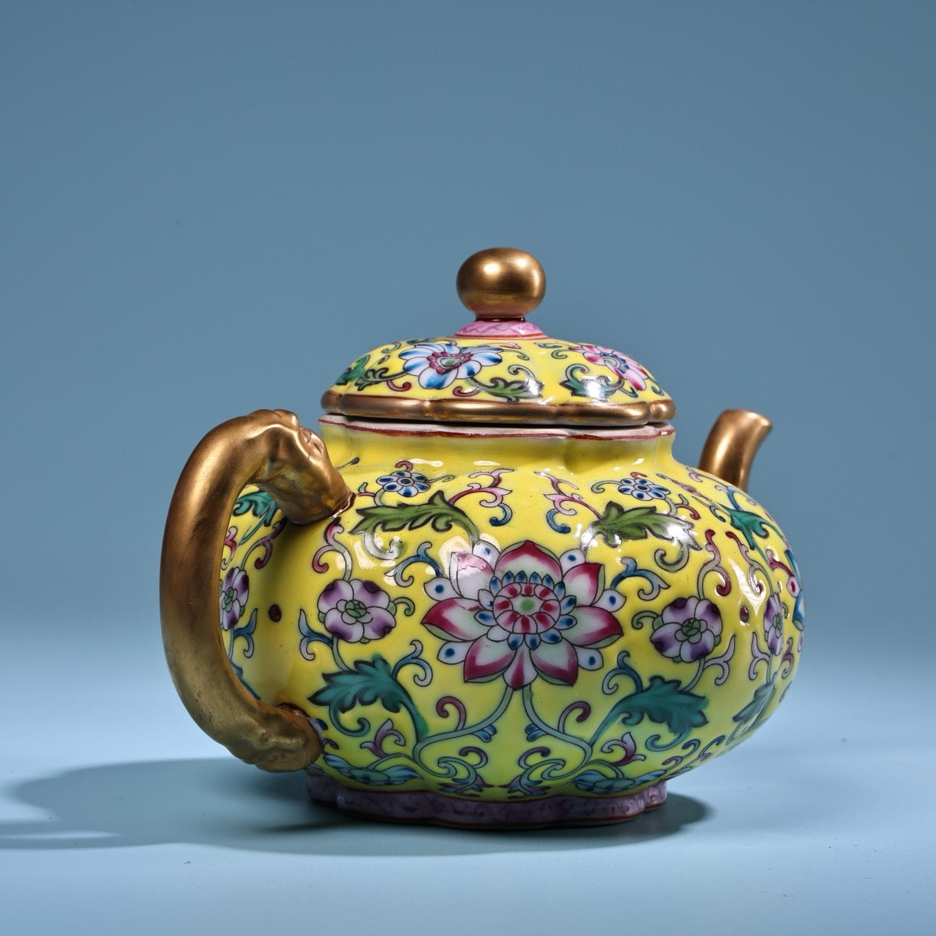 Enamel gilded gold colored porcelain teapot
