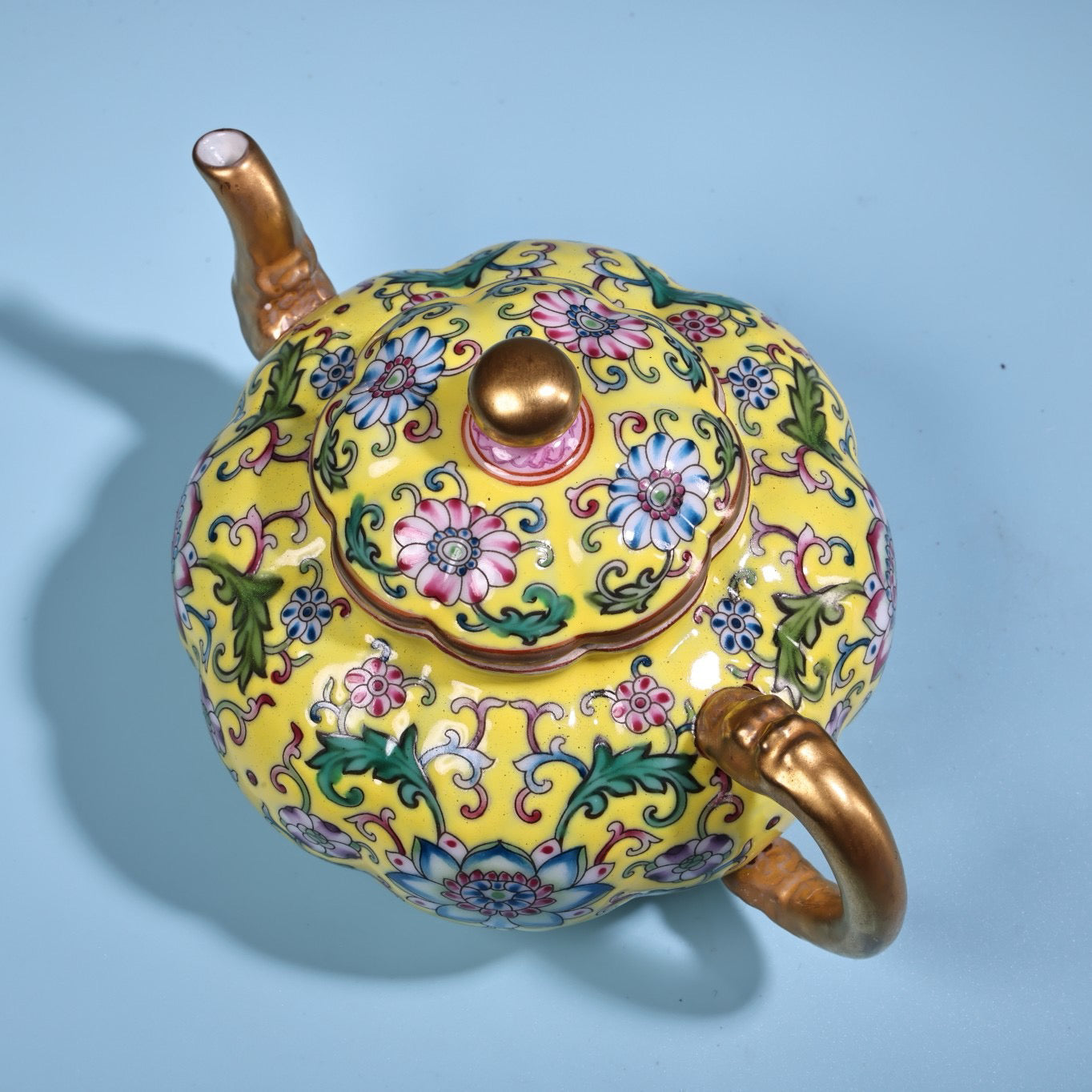 Enamel gilded gold colored porcelain teapot