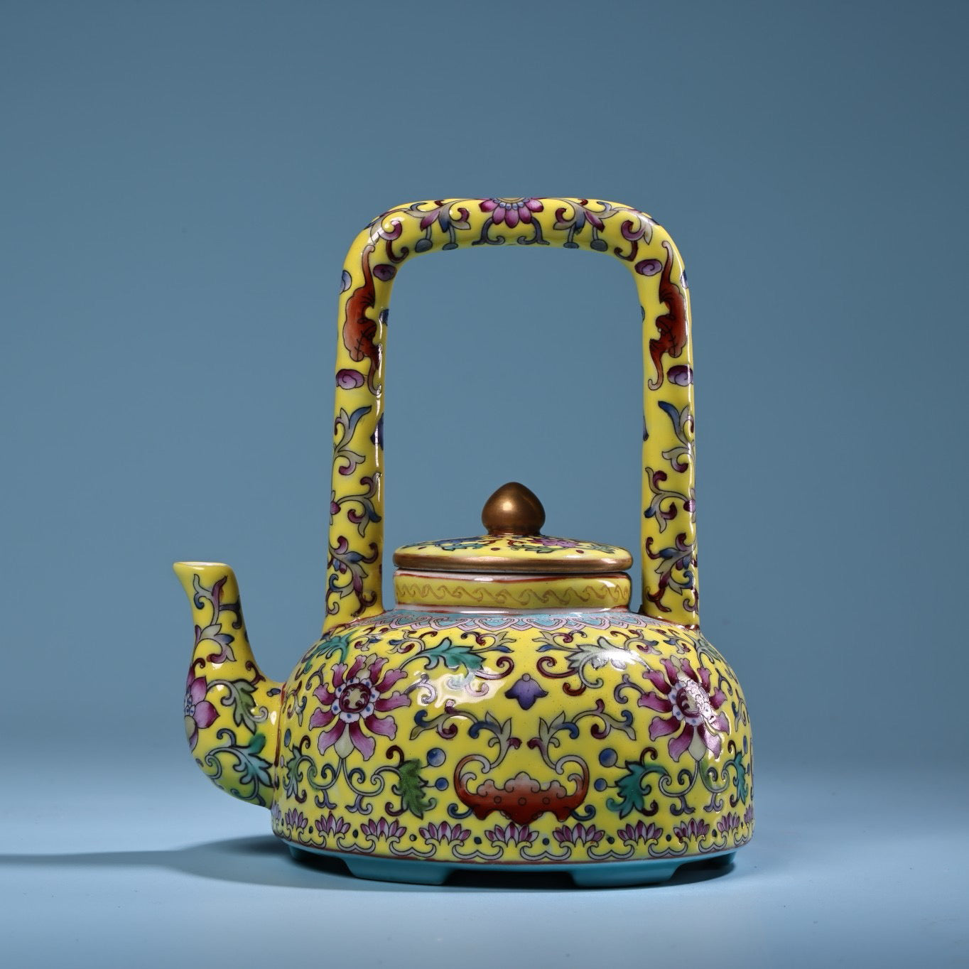 Hand painted enamel gilded gold colored porcelain lifting beam teapot