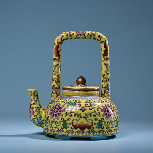 Hand painted enamel gilded gold colored porcelain lifting beam teapot