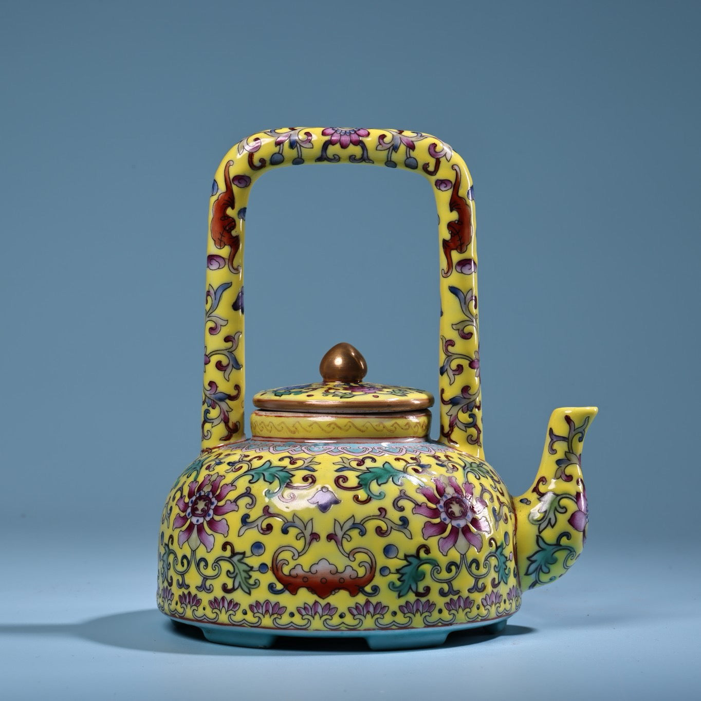 Hand painted enamel gilded gold colored porcelain lifting beam teapot
