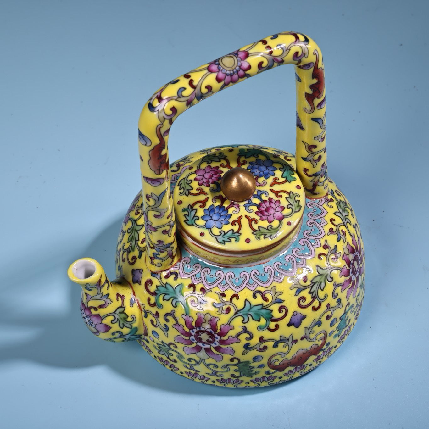 Hand painted enamel gilded gold colored porcelain lifting beam teapot