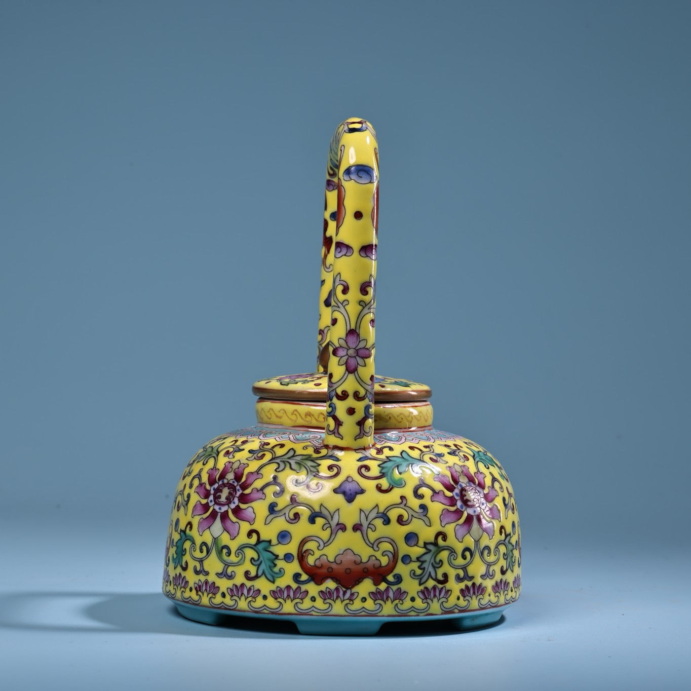 Hand painted enamel gilded gold colored porcelain lifting beam teapot