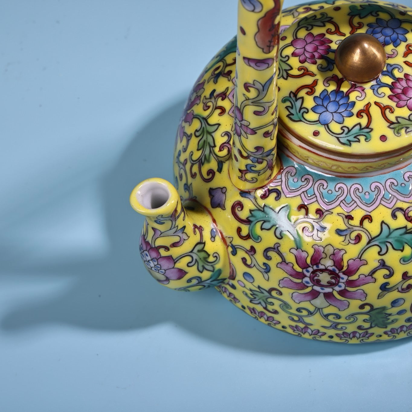 Hand painted enamel gilded gold colored porcelain lifting beam teapot