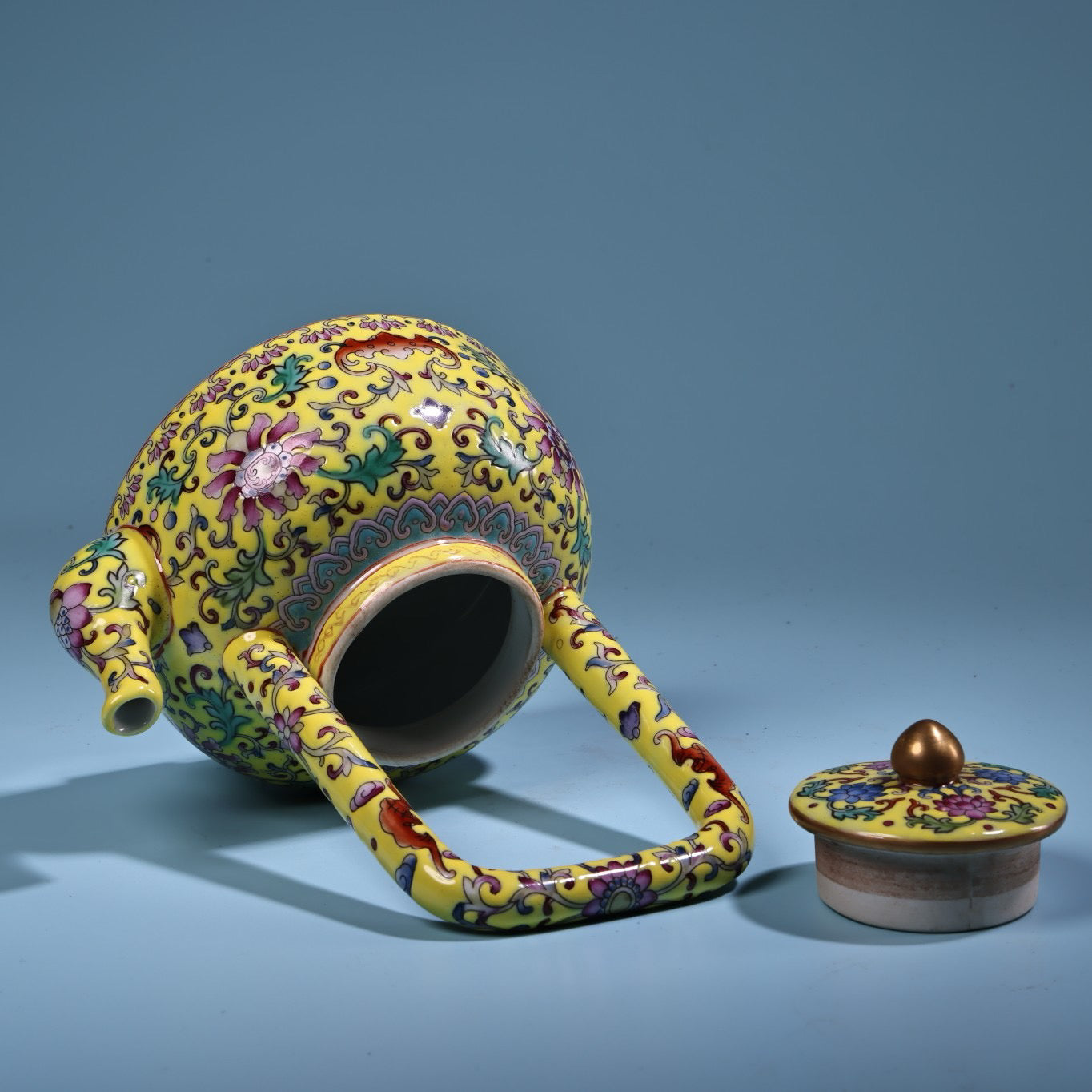 Hand painted enamel gilded gold colored porcelain lifting beam teapot