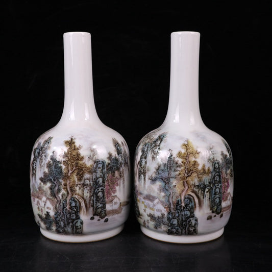 A pair of pink landscape patterned rocking bell bottles