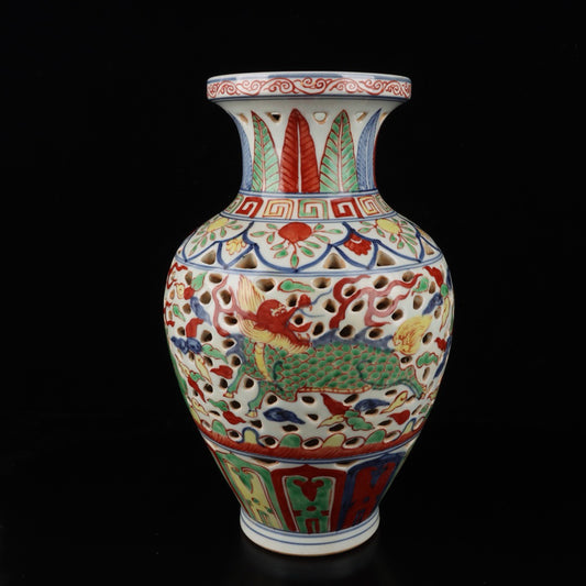 Blue and white hollowed out bottle with colorful Kirin pattern