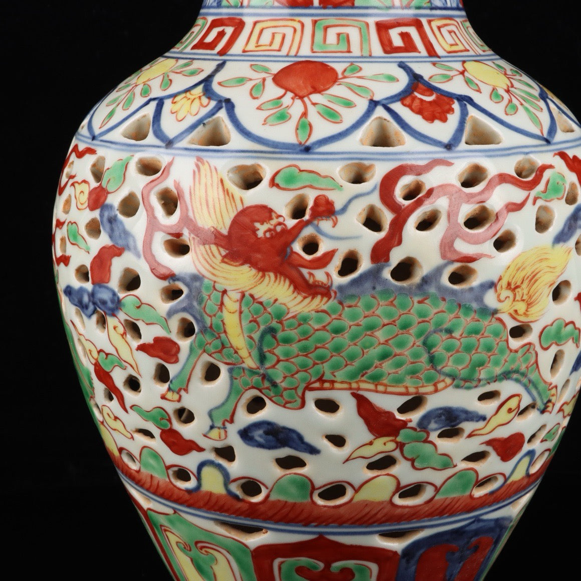 Blue and white hollowed out bottle with colorful Kirin pattern