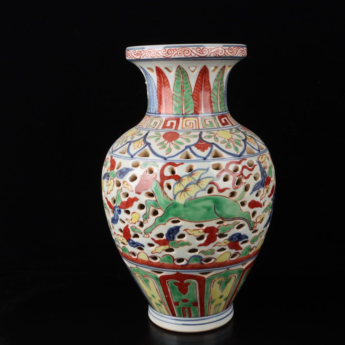 Blue and white hollowed out bottle with colorful Kirin pattern