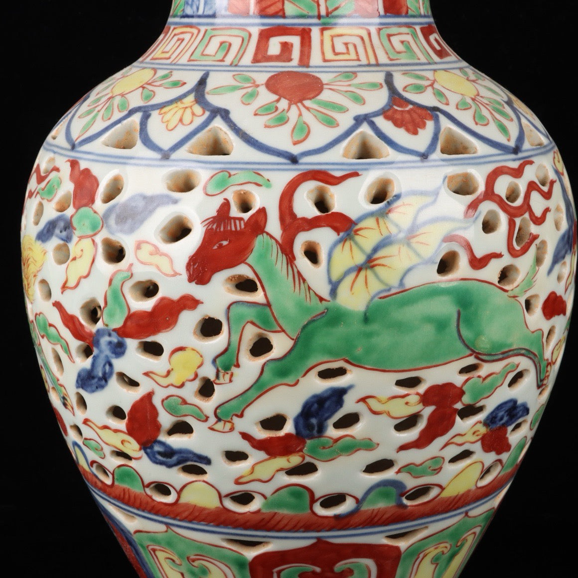 Blue and white hollowed out bottle with colorful Kirin pattern