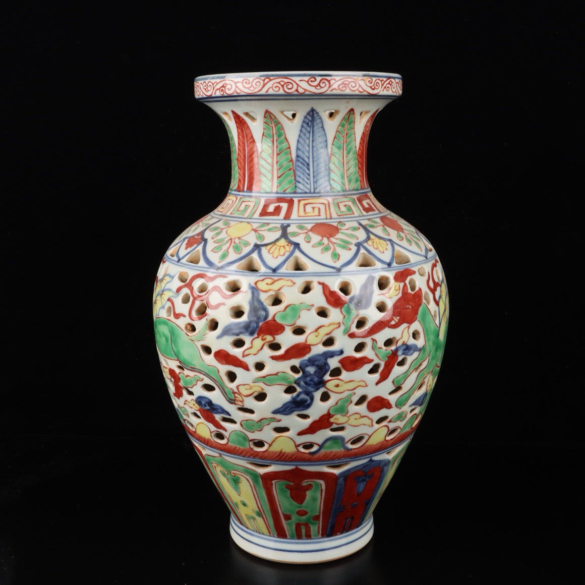 Blue and white hollowed out bottle with colorful Kirin pattern