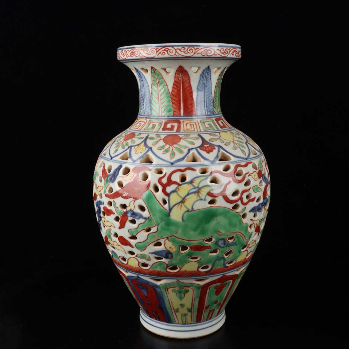 Blue and white hollowed out bottle with colorful Kirin pattern