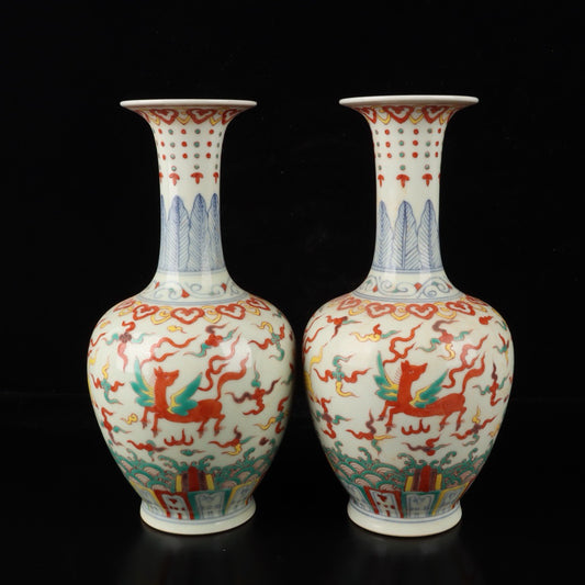 A pair of colorful Pegasus patterned bottles