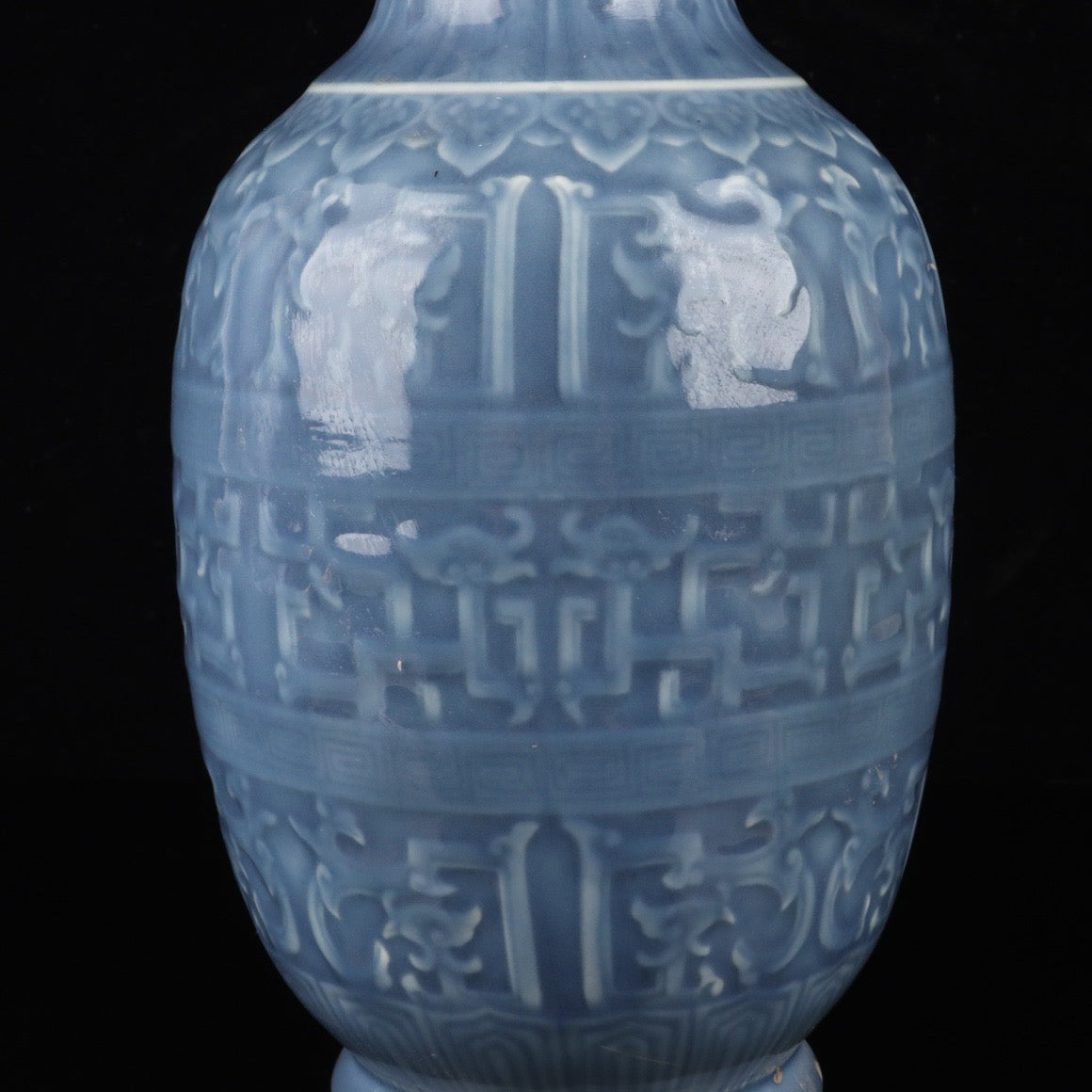 Monochrome glazed relief dragon vase
