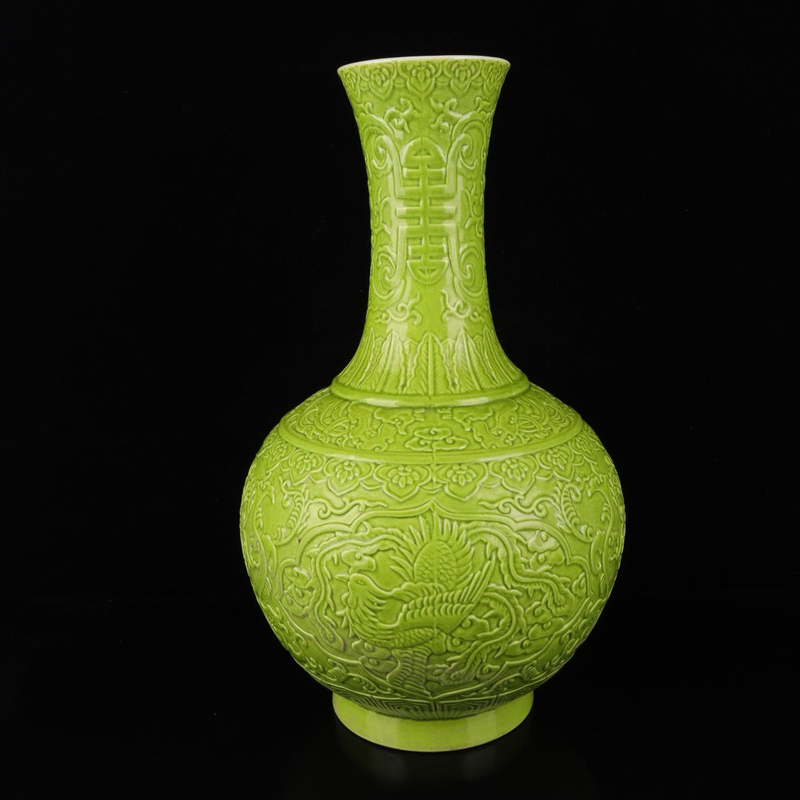 Monochrome glazed relief vase with auspicious dragon and phoenix patterns