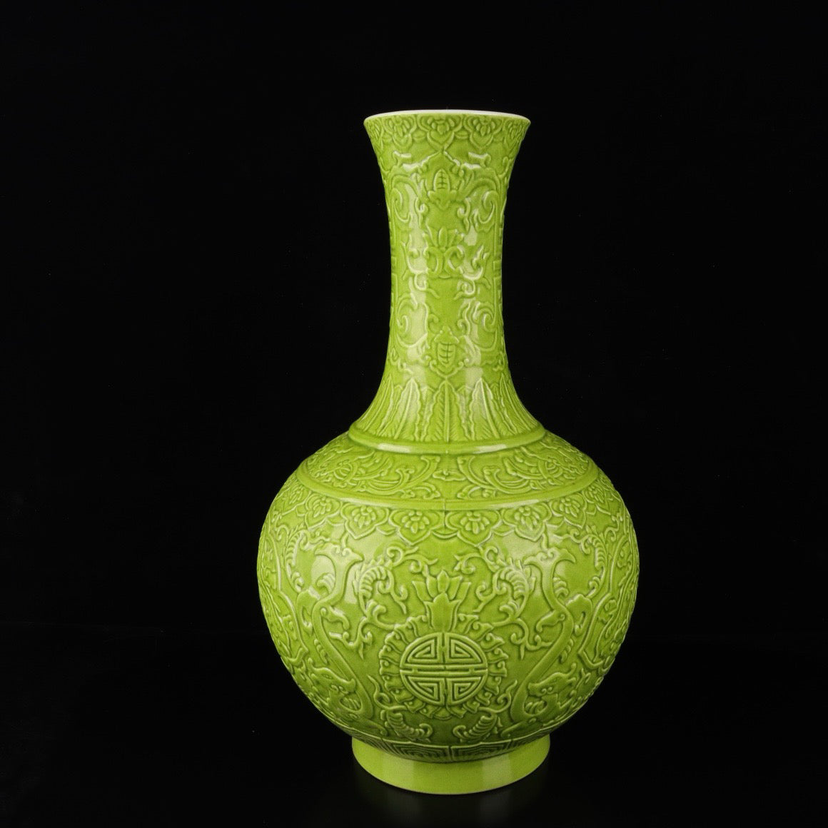 Monochrome glazed relief vase with auspicious dragon and phoenix patterns