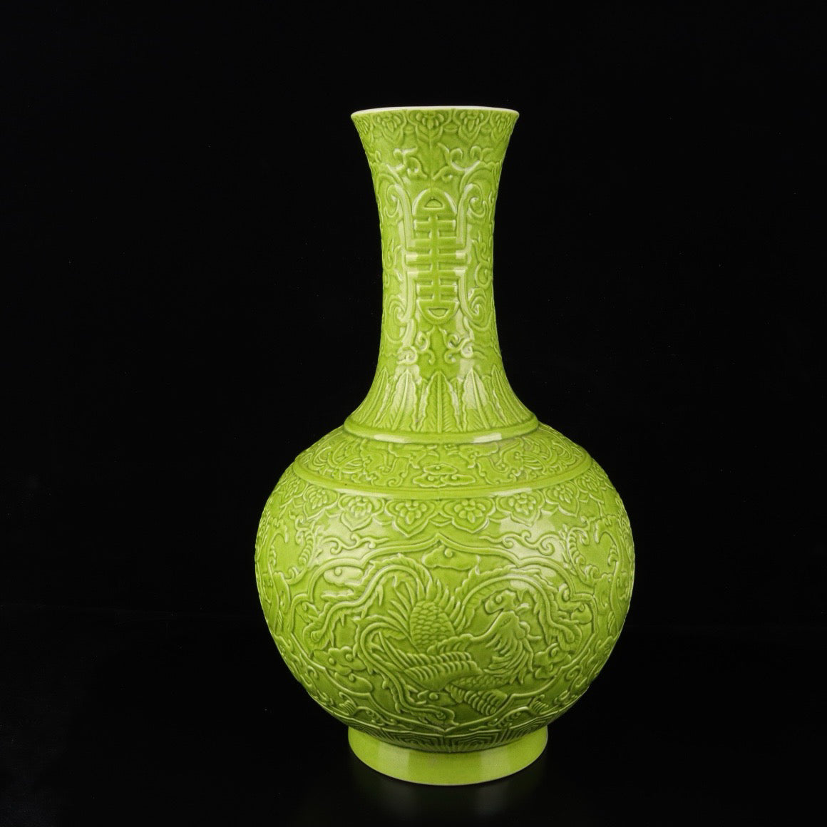 Monochrome glazed relief vase with auspicious dragon and phoenix patterns