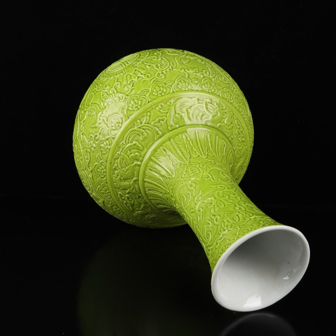 Monochrome glazed relief vase with auspicious dragon and phoenix patterns