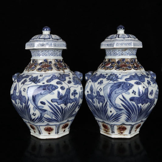 A pair of blue and white glazed, red pinched flower, fish and algae pattern, animal ear lid jars