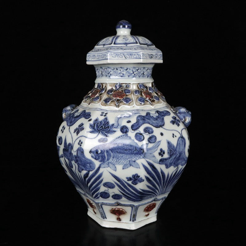 A pair of blue and white glazed, red pinched flower, fish and algae pattern, animal ear lid jars