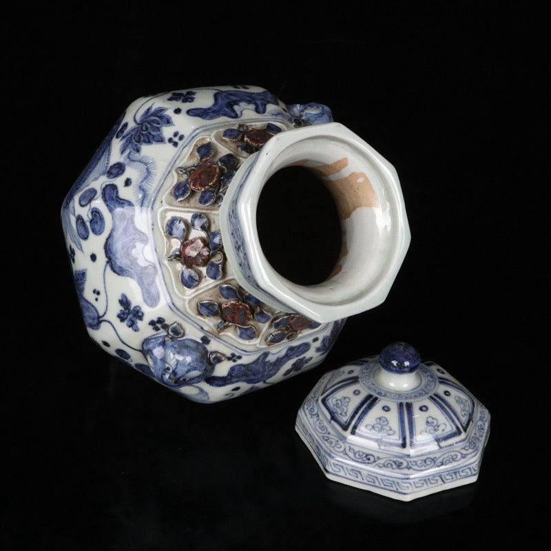 A pair of blue and white glazed, red pinched flower, fish and algae pattern, animal ear lid jars