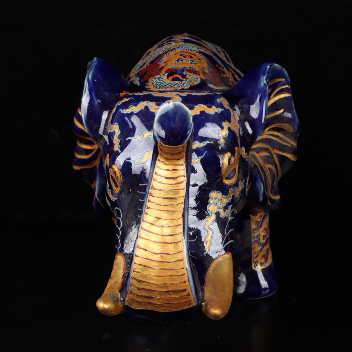 Elephant with colorful golden cloud and dragon patterns